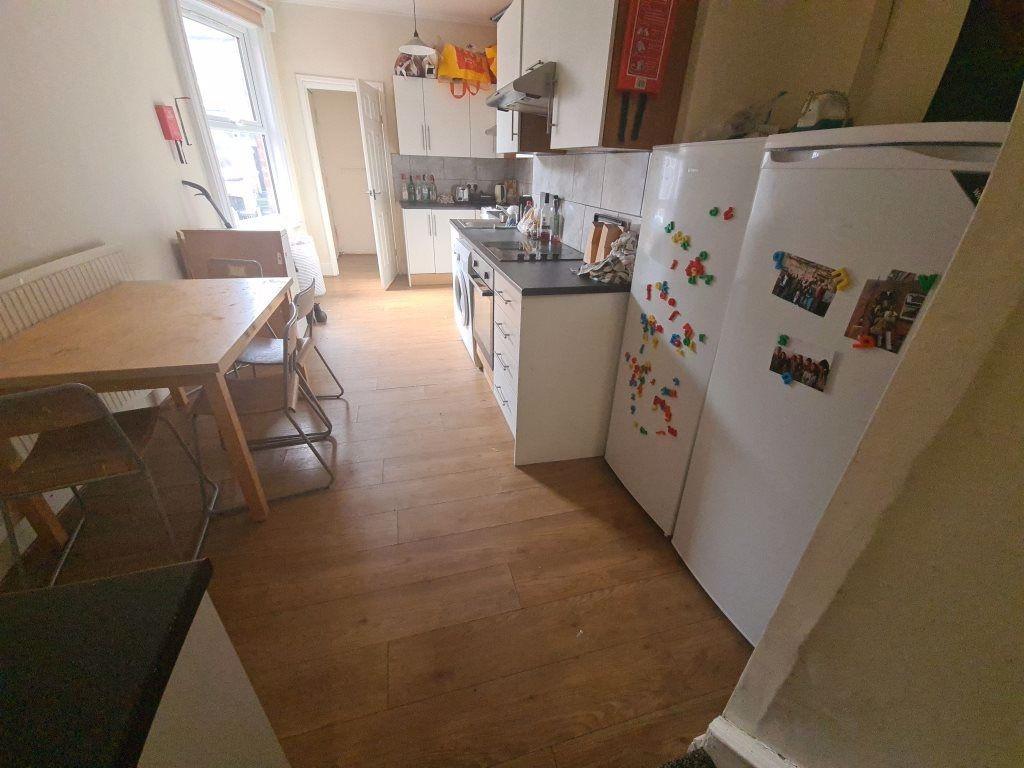 Bright and functional kitchen space featuring a...