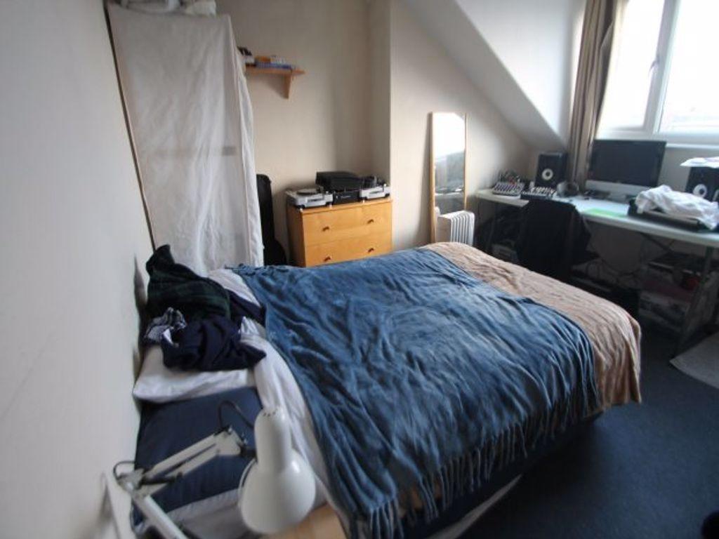 Cozy double bedroom with a large window allowin...