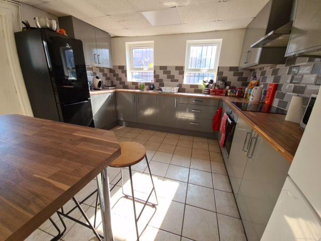 Bright and modern kitchen with ample counter sp...
