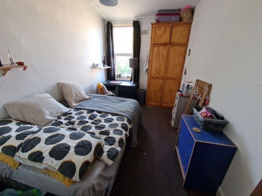 Cozy double bedroom featuring a double bed and ...