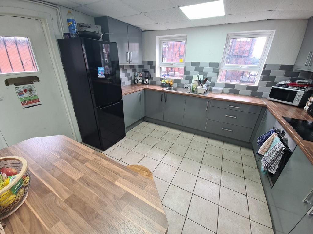 Bright and modern kitchen featuring ample count...