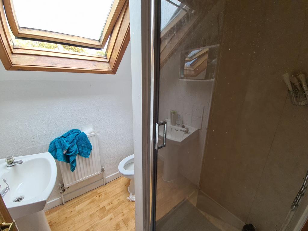 A modern bathroom with a shower cubicle, featur...