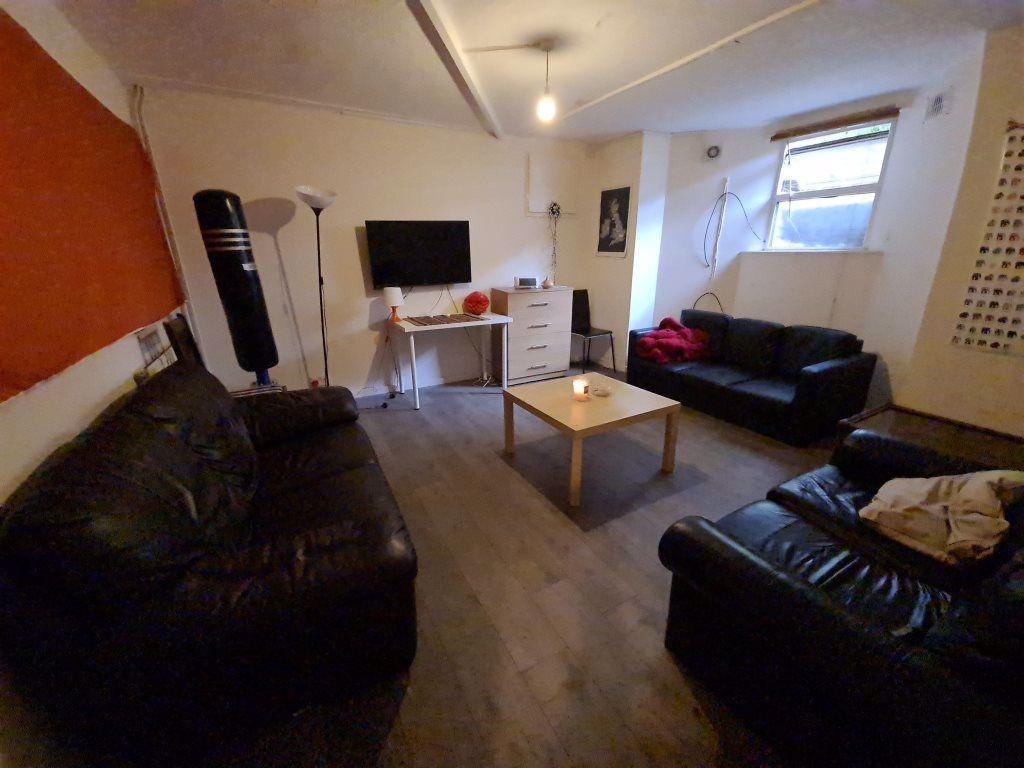 A spacious and welcoming living room featuring ...
