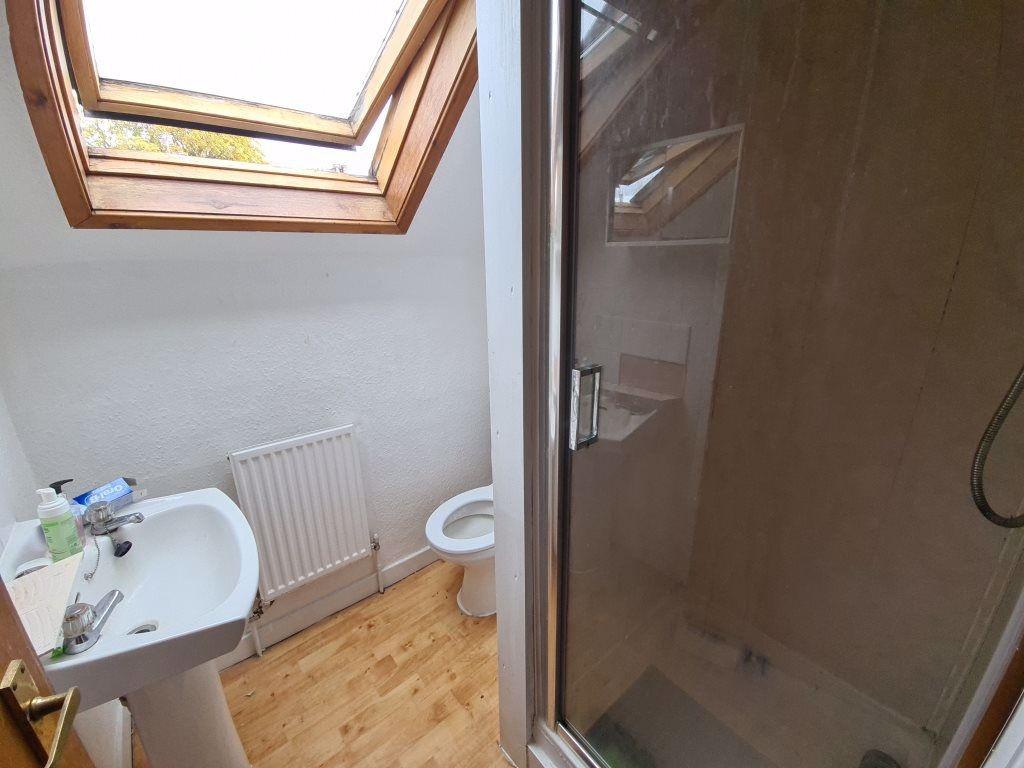 A clean and well-maintained bathroom with a sho...