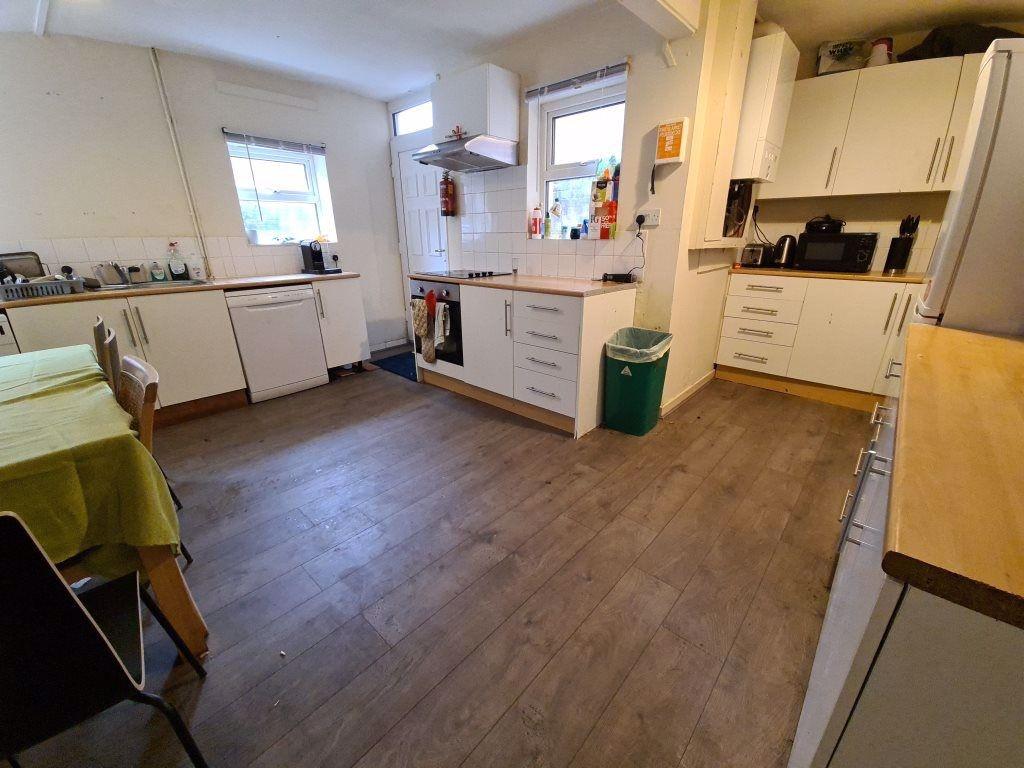 Bright and modern kitchen with ample counter sp...
