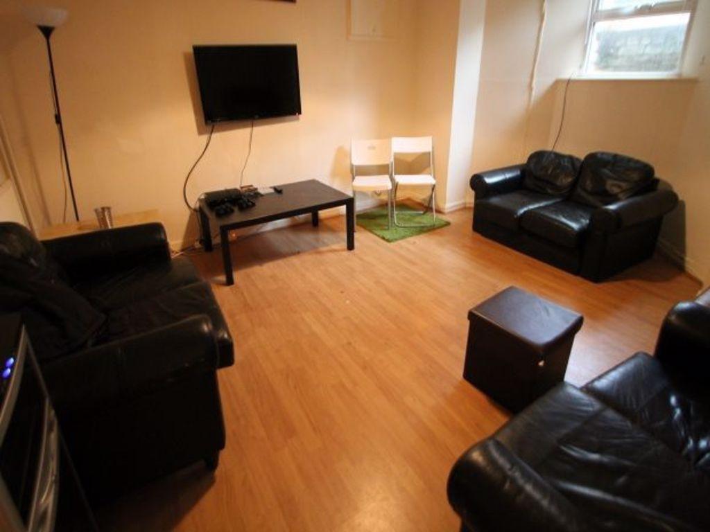 Bright and welcoming living room featuring comf...