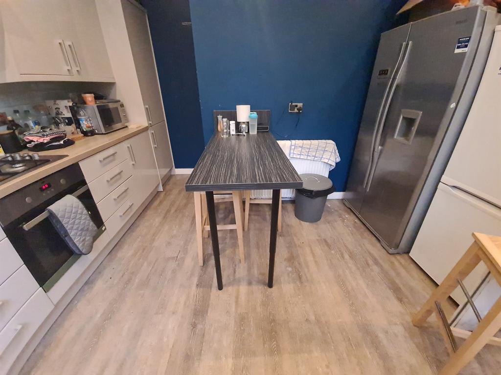 Contemporary kitchen featuring a large stainles...