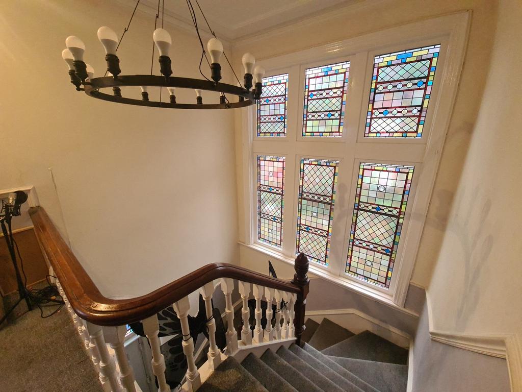 A charming staircase featuring elegant wooden b...