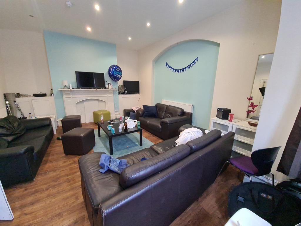 A comfortable living room featuring multiple le...