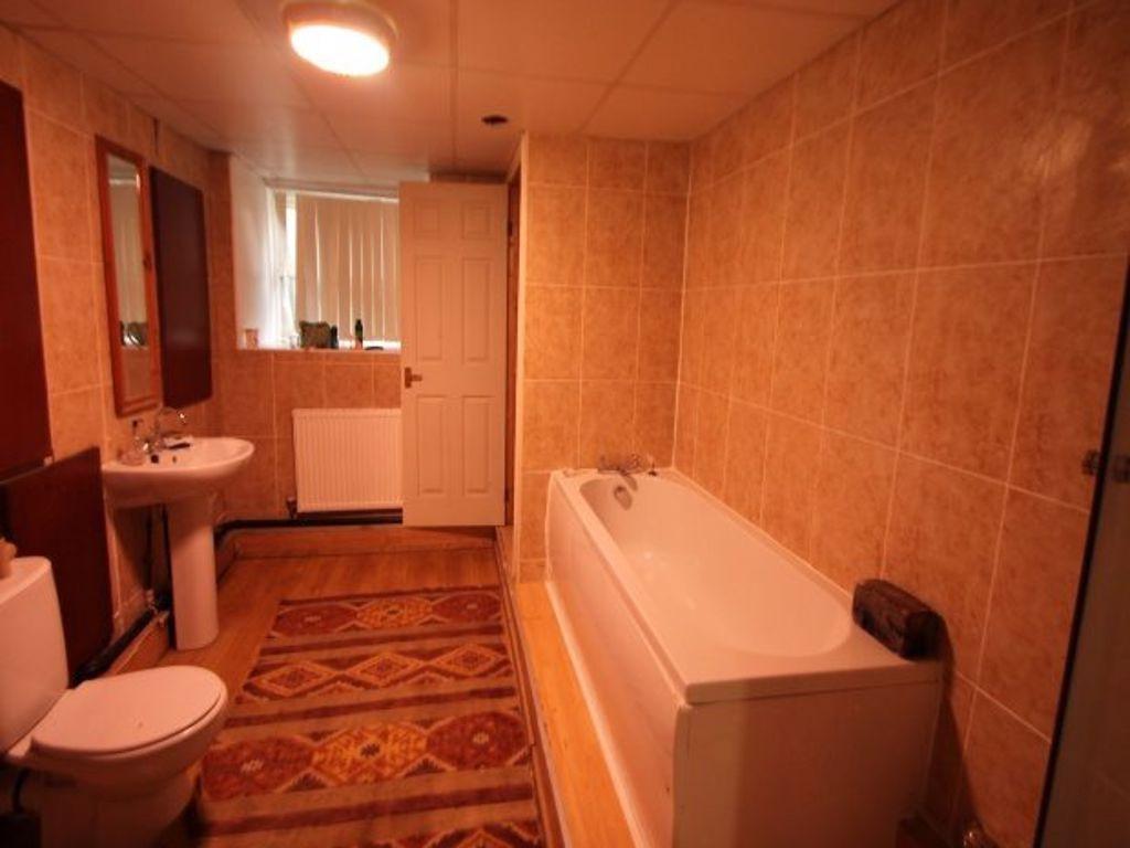 A spacious bathroom suite featuring a full bath...