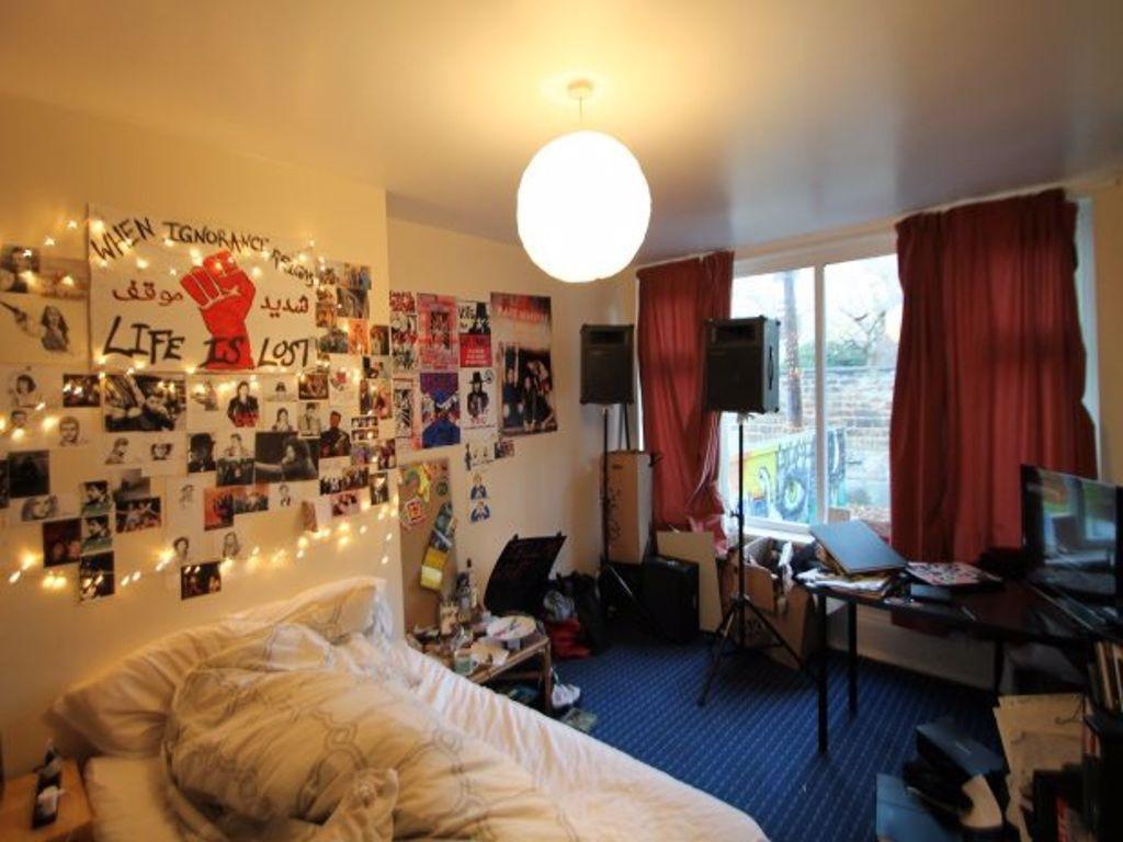 Cozy and personalized bedroom corner with a com...