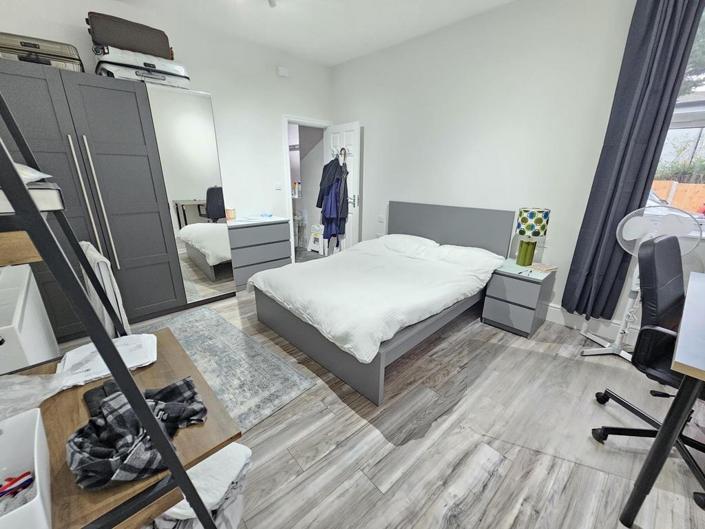 Bright and modern double bedroom featuring a co...