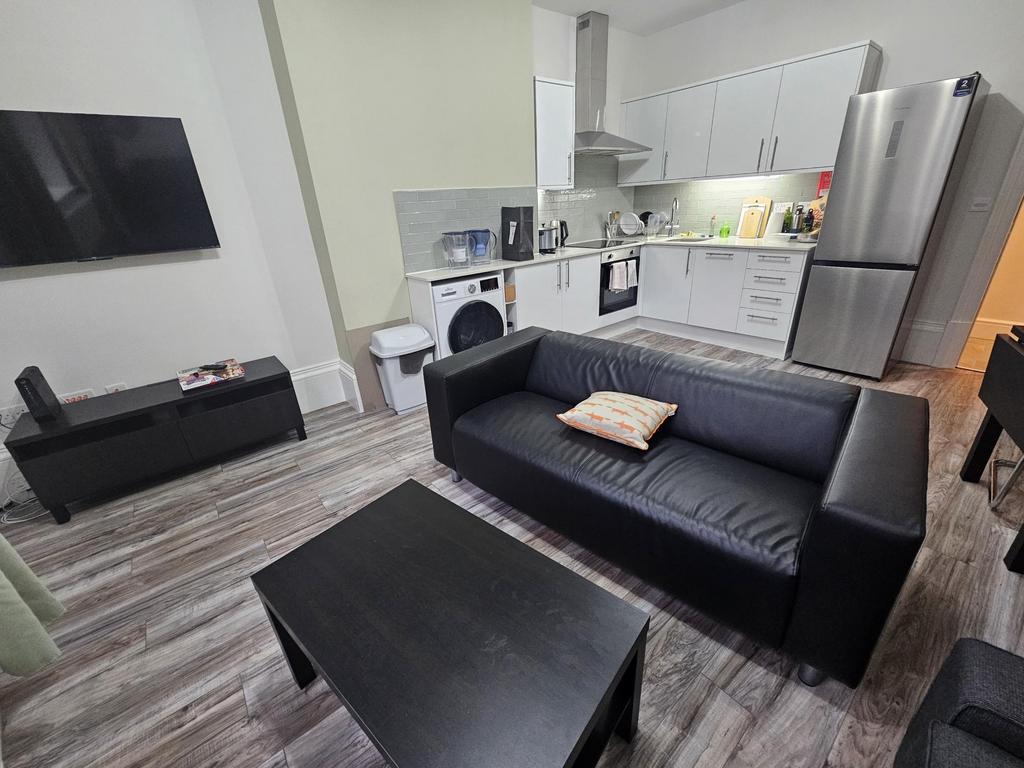 Modern and well-maintained living room featurin...