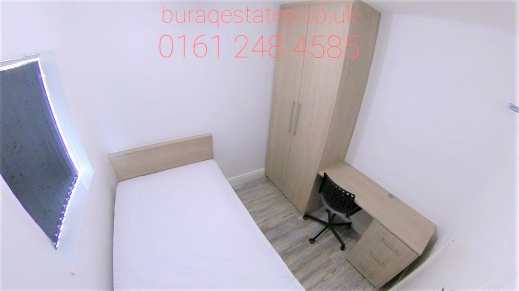 A compact, neat bedroom featuring a single bed,...
