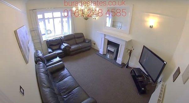 Bright and welcoming living room featuring comf...
