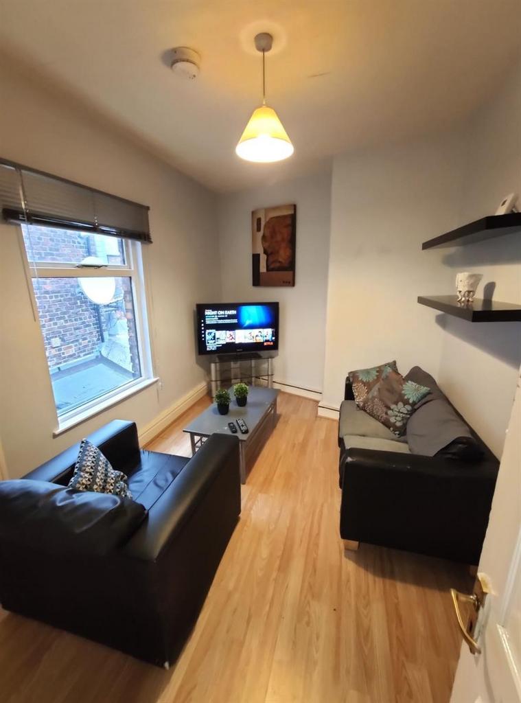 A cozy and modern living room featuring comfort...