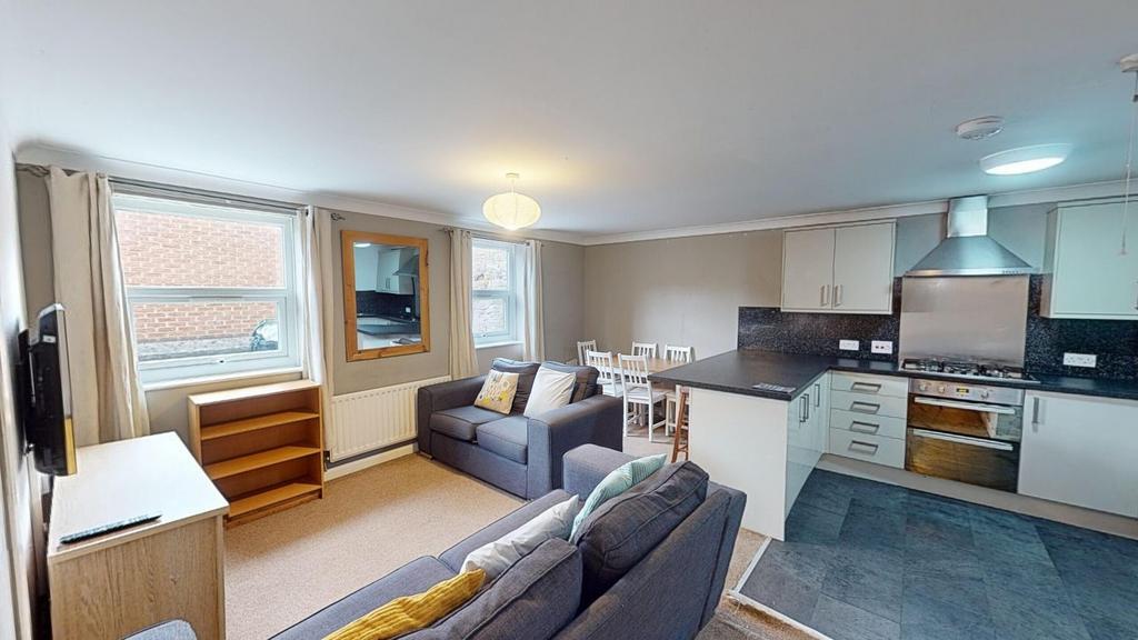 A spacious and inviting large modern living roo...