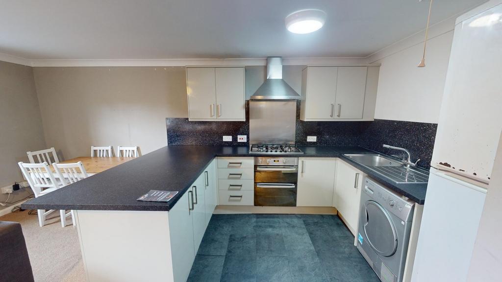 A modern and well-equipped kitchenette featurin...