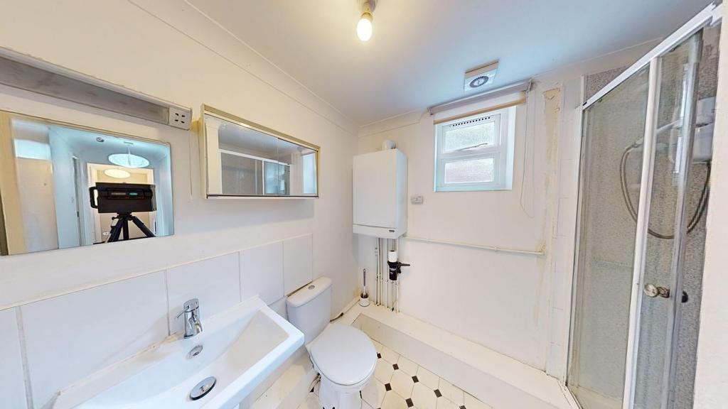 A bright and clean bathroom featuring modern fi...