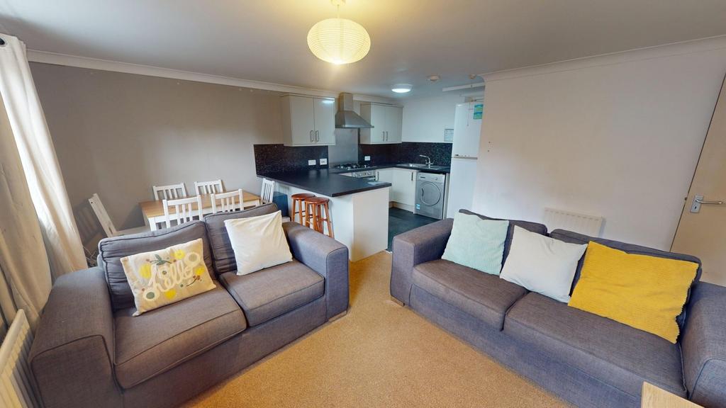 A spacious and modern living room perfect for s...