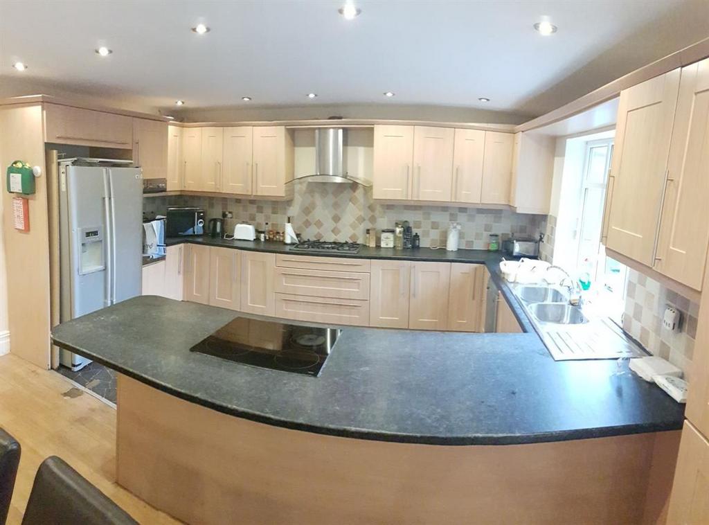 A modern, well-maintained kitchen featuring amp...