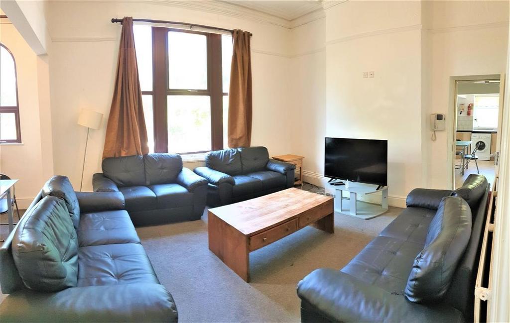 Bright and welcoming living room featuring comf...