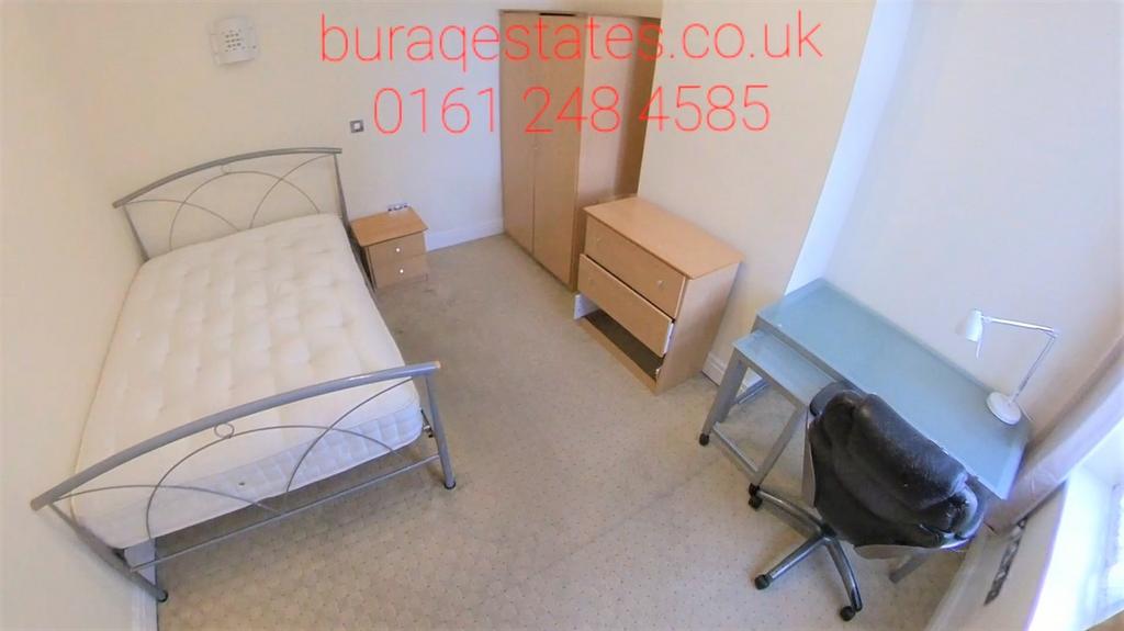 A neatly arranged single bedroom featuring a me...