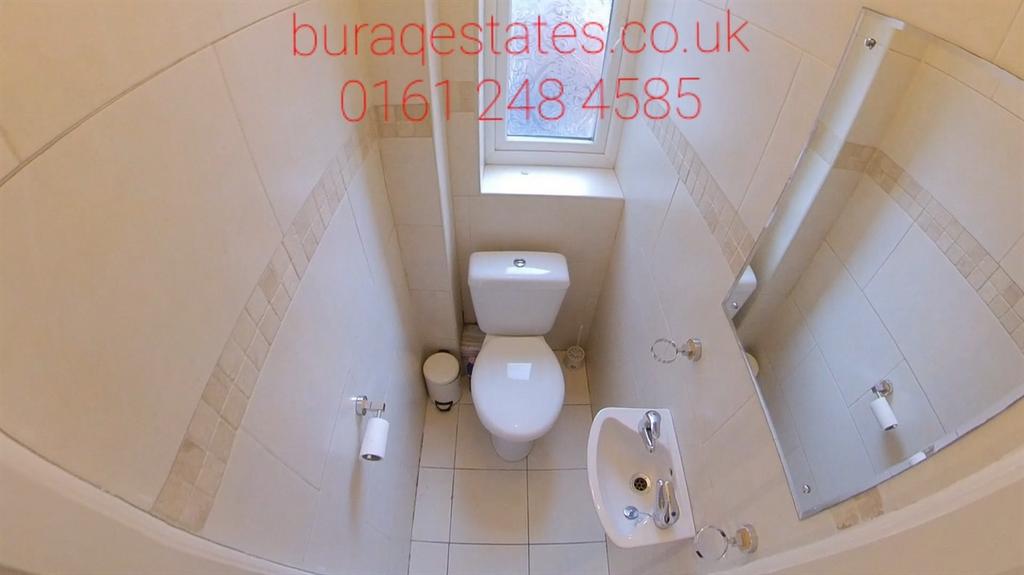 A clean and well-maintained small toilet room f...