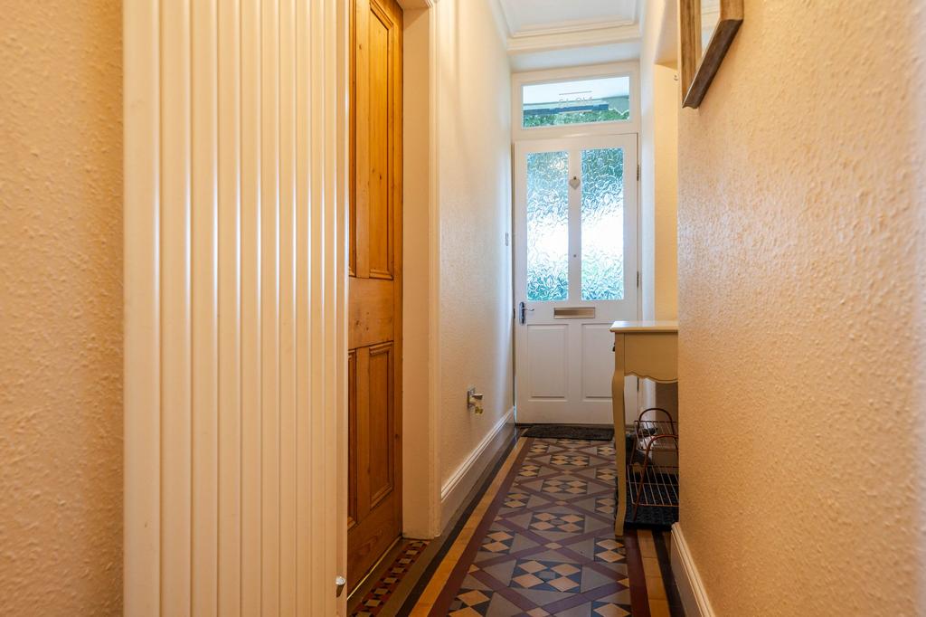 Entrance hall with original tiling