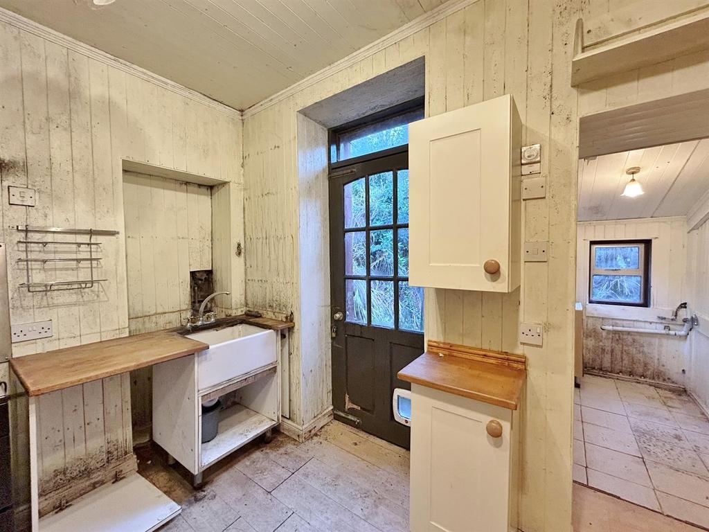 Kitchen showing utility area.