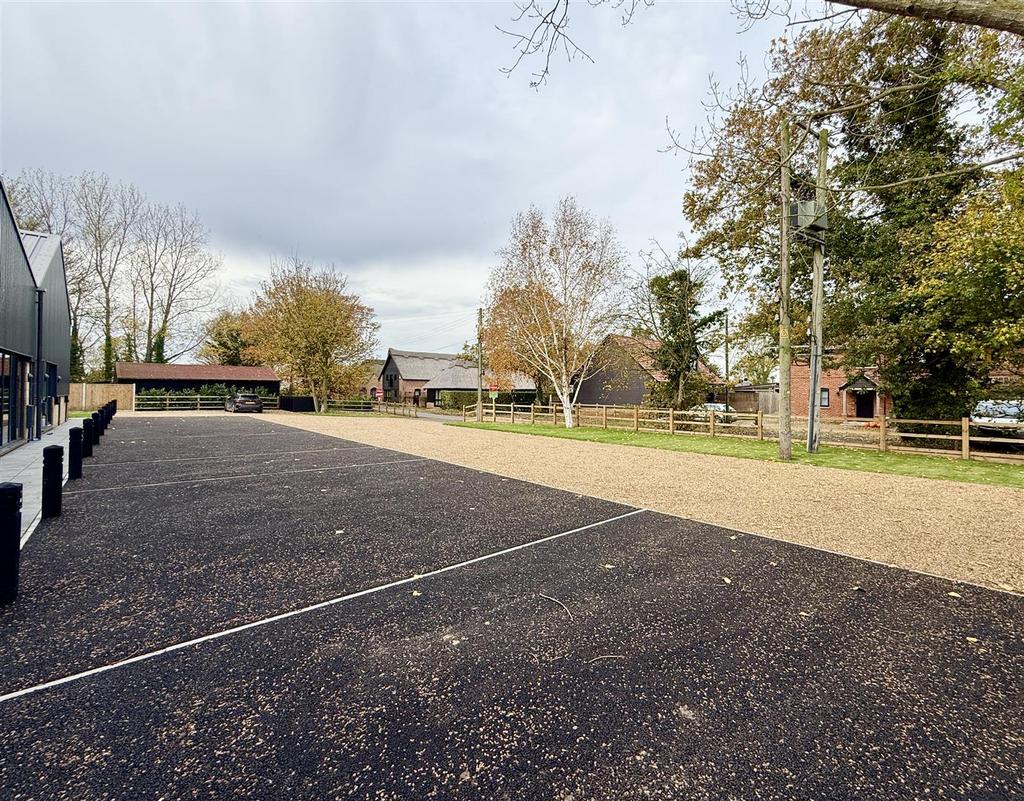 Parking and communal grounds to front