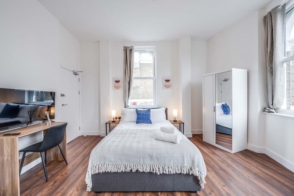 Bright and inviting double bedroom featuring a ...