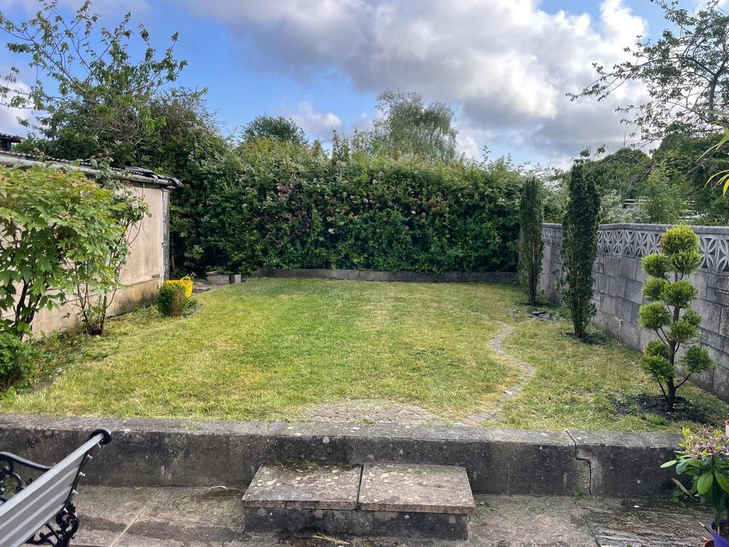 A well-maintained private garden featuring a ne...