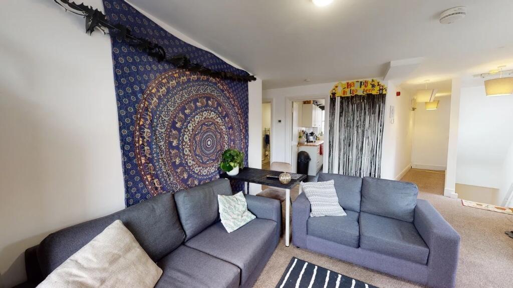 Contemporary living room with comfortable grey ...