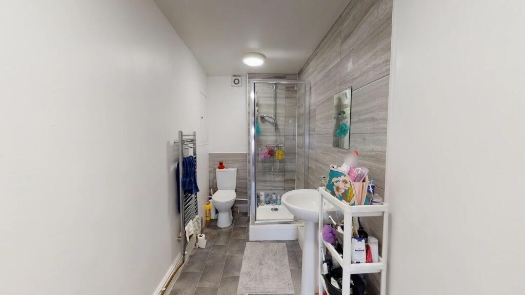 A modern, well-maintained bathroom featuring a ...