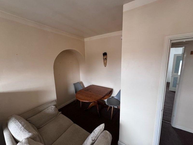 Cozy living room featuring a comfortable sofa a...
