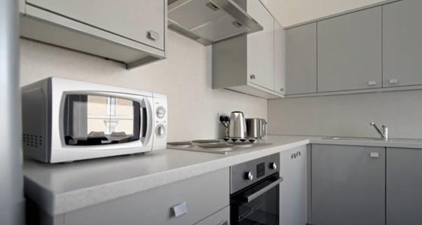 A modern, well-maintained kitchen featuring sle...