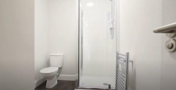 A clean and simple bathroom area featuring a wh...