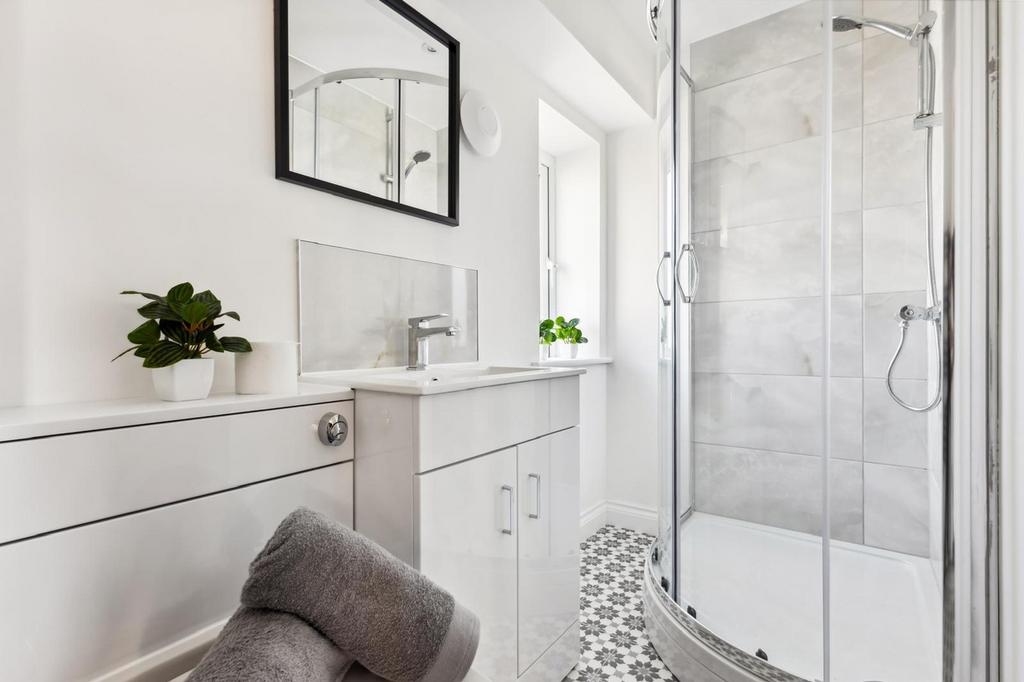 A bright and modern bathroom featuring a sleek ...