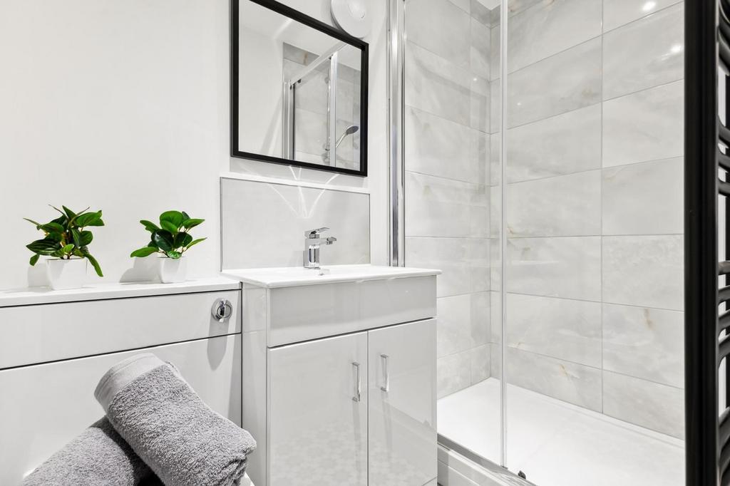 A modern and stylish bathroom featuring a sleek...