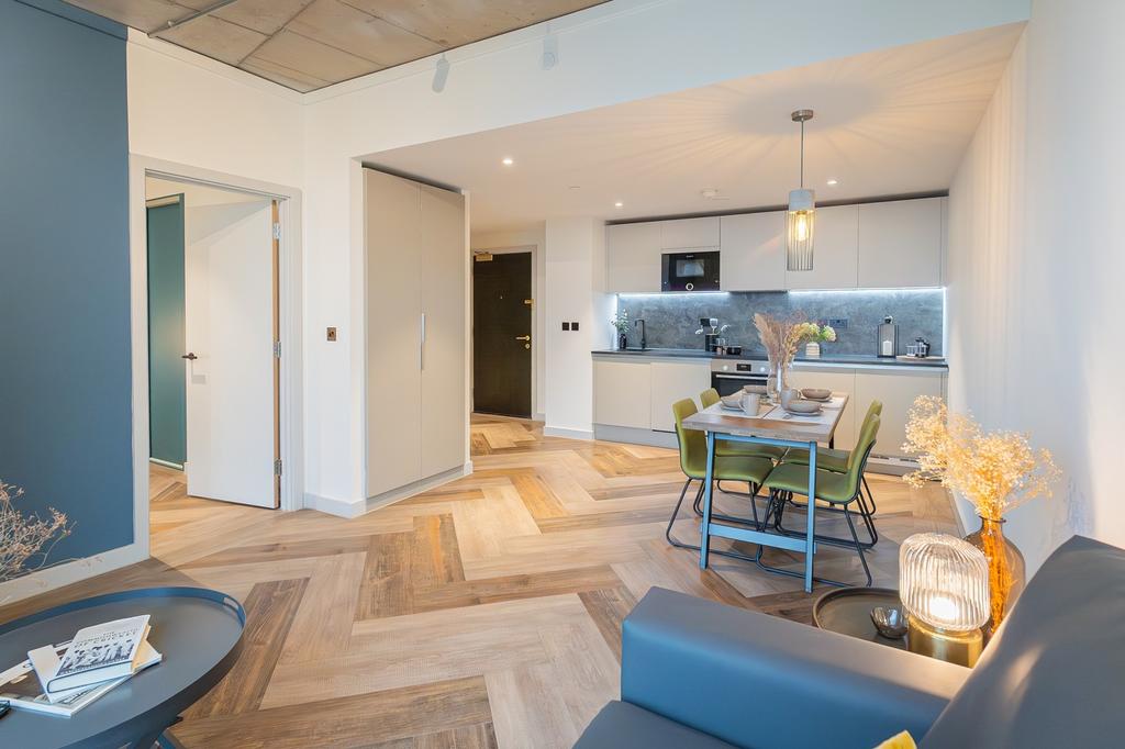 A modern and inviting kitchenette with stylish ...