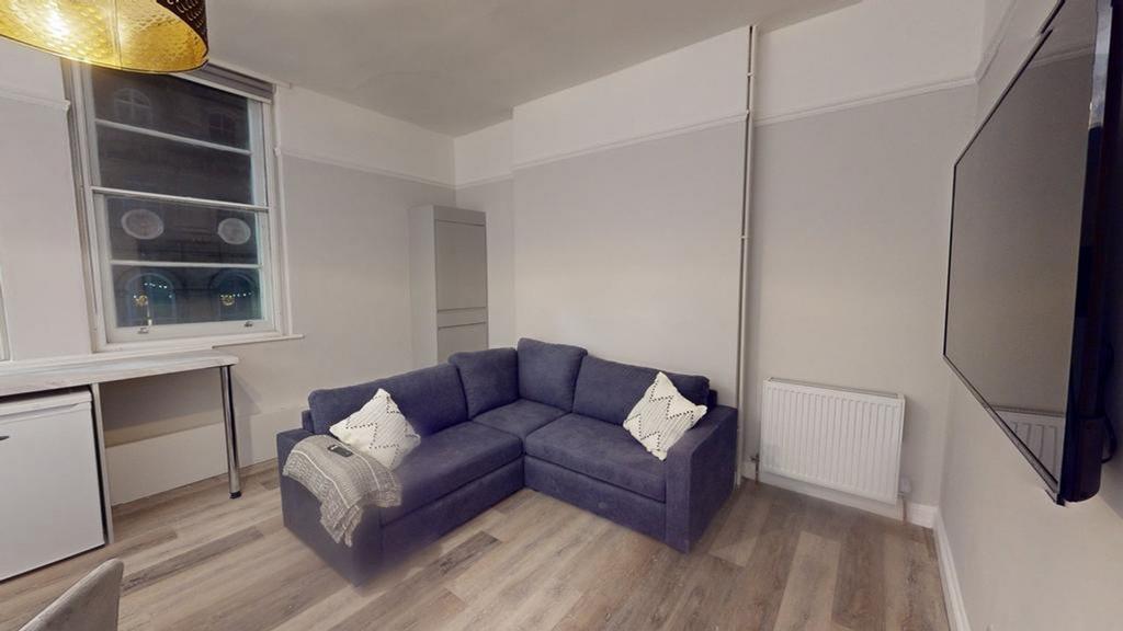 A bright and inviting living room, perfect for ...