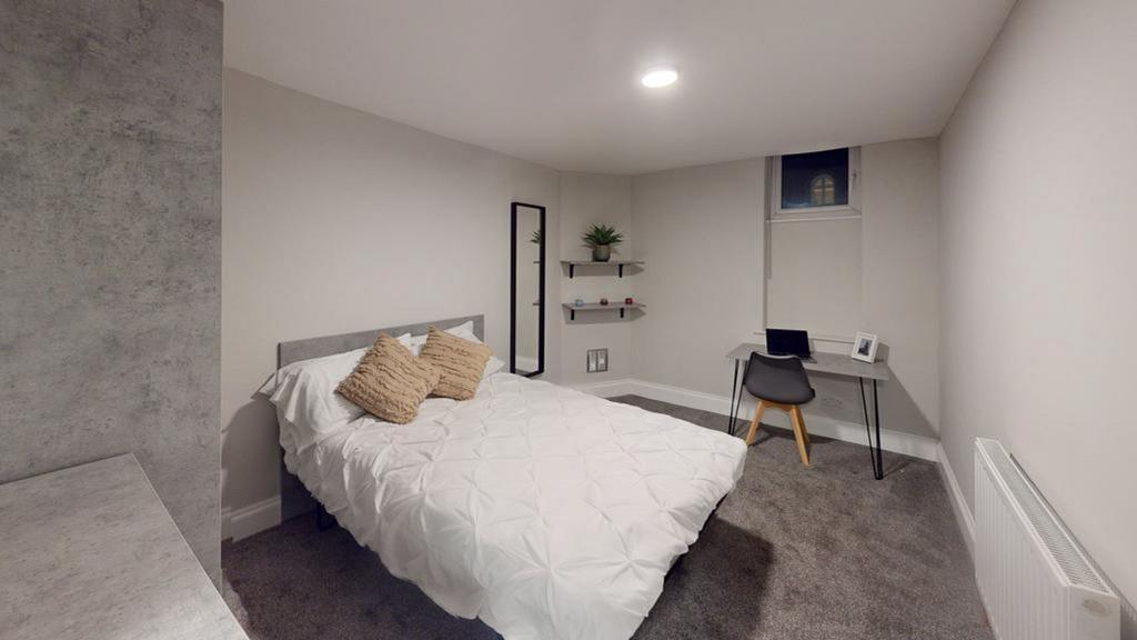 A cozy and well-maintained double bedroom, perf...