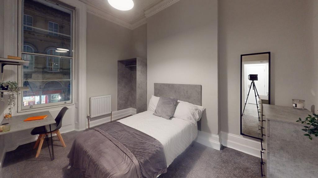 A stylish and well-lit double bedroom featuring...