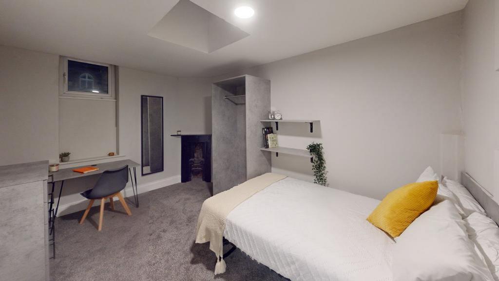A stylish and spacious double bedroom featuring...