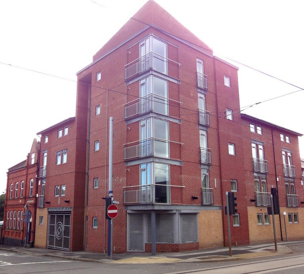 A modern, well-maintained red brick building lo...