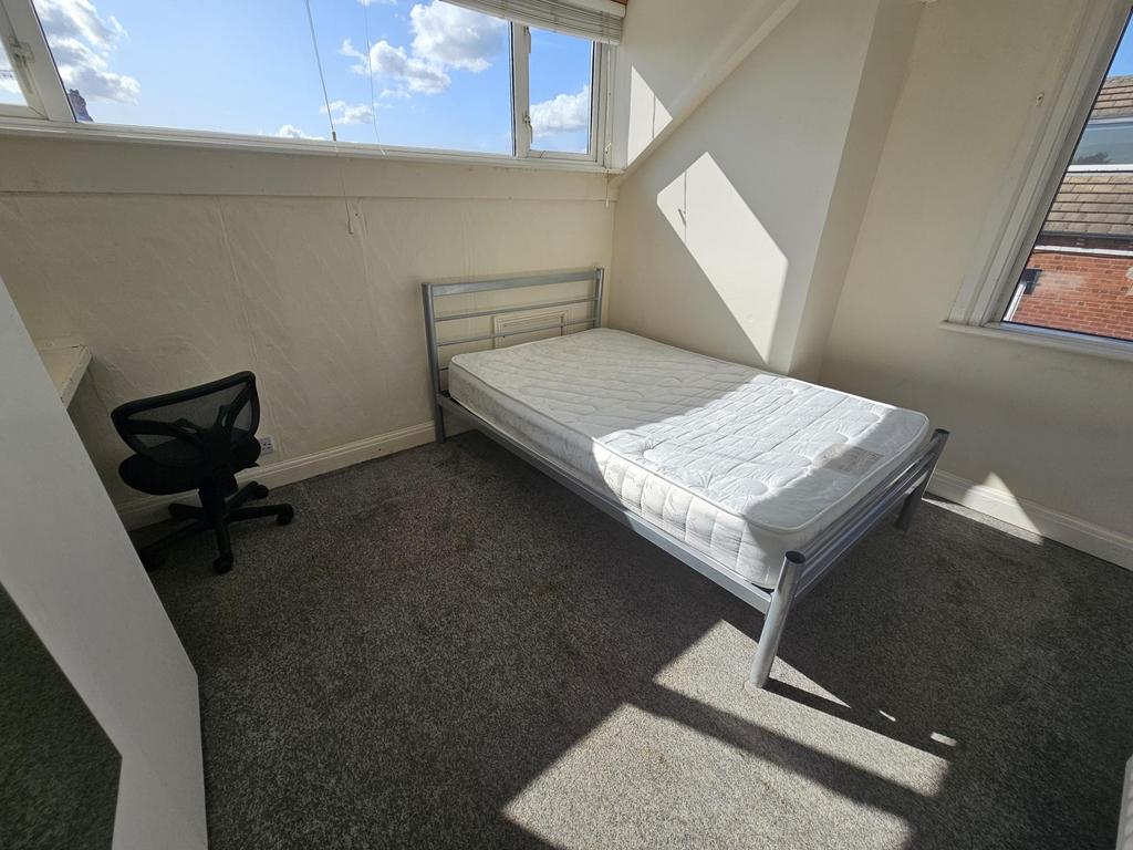 Bright and airy bedroom with large windows allo...