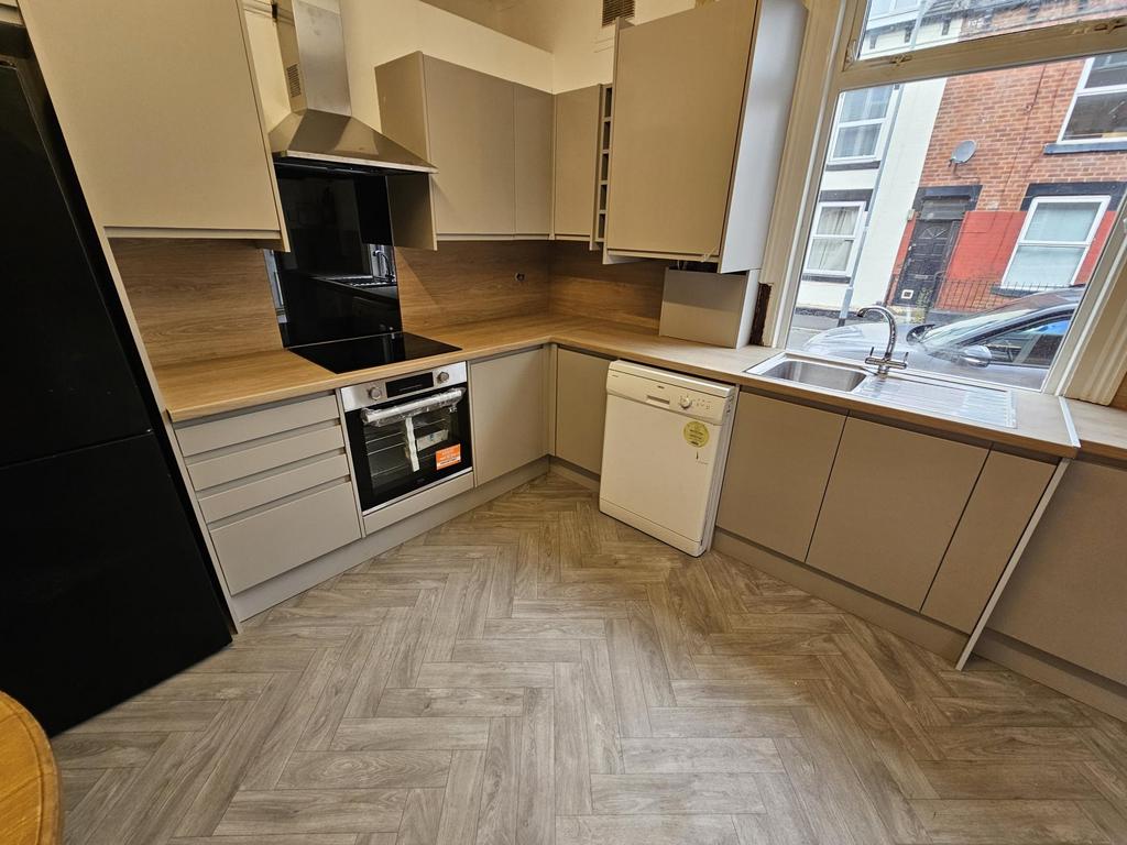 Modern kitchen space with ample natural light, ...