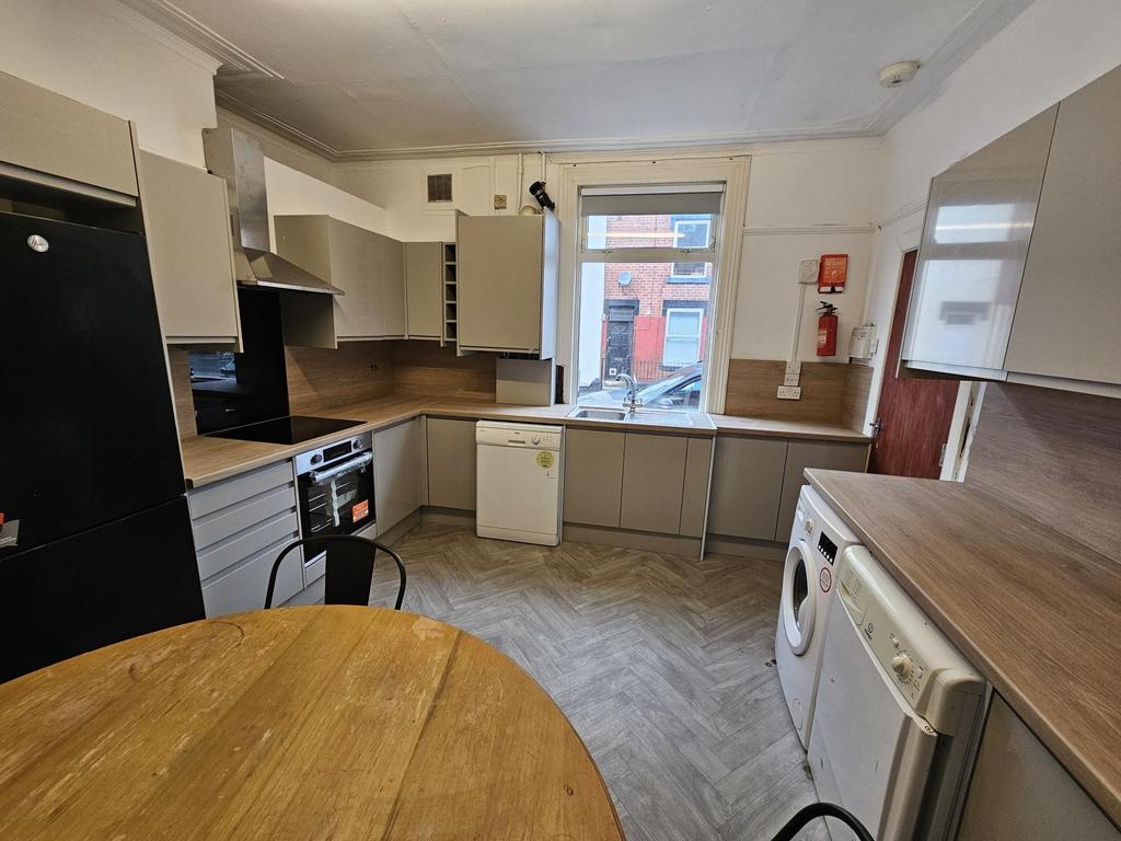 A functional kitchen area featuring essential a...