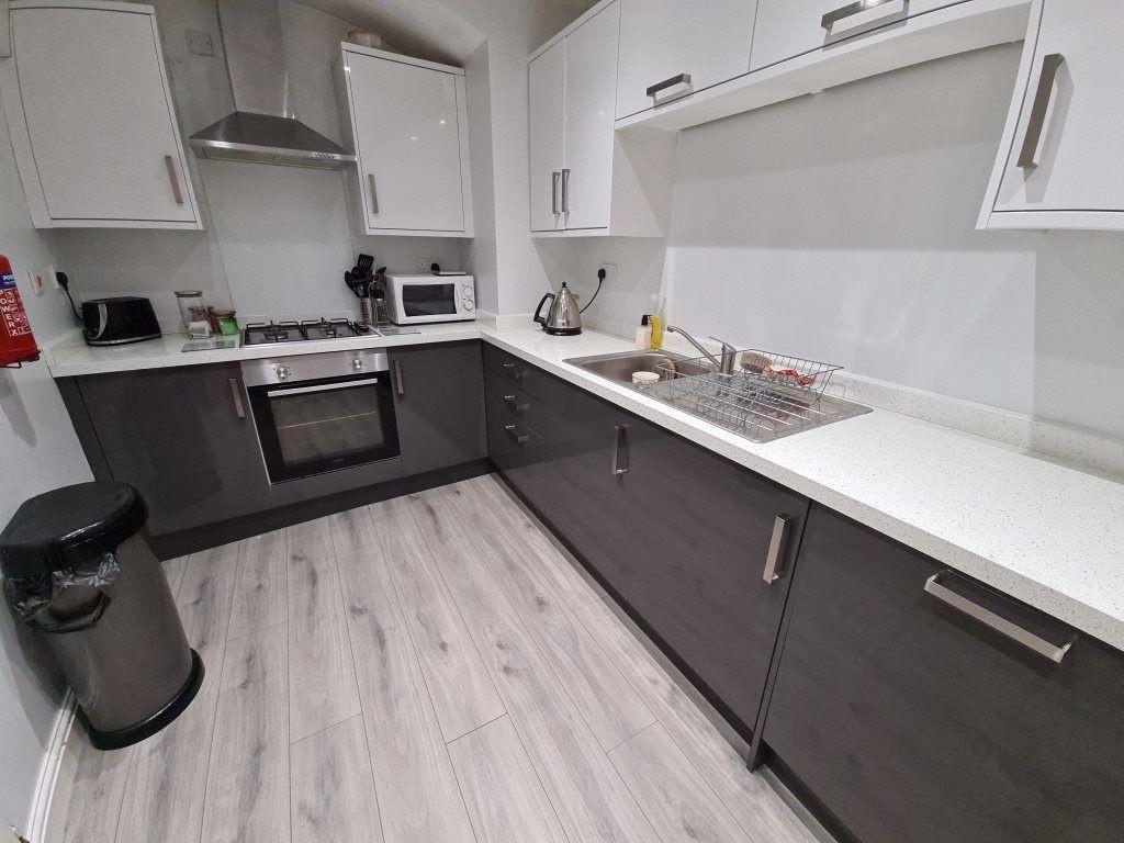 Modern, clean kitchen with ample counter space ...